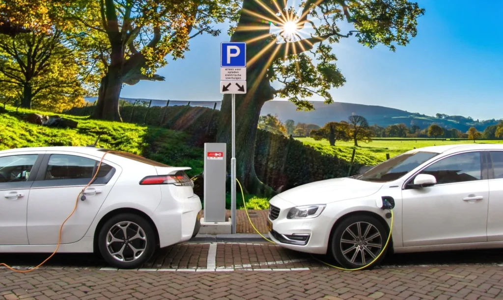 Smart EV charger connected to an electric car for scheduled charging during off-peak hours